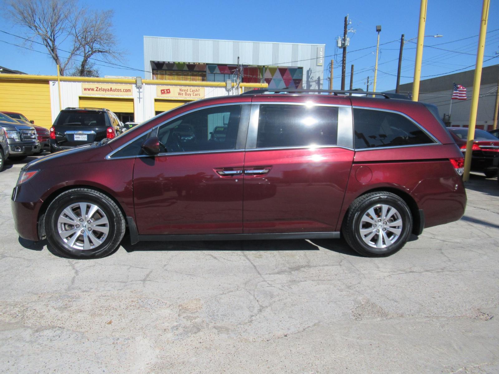 2016 Red /Tan Honda Odyssey EX-L (5FNRL5H62GB) with an 3.5L V6 SOHC 24V engine, Automatic transmission, located at 1511 North Shepherd Dr., Houston, TX, 77008, (281) 657-1221, 29.798361, -95.412560 - 2016 HONDA ODYSSEY EX-L VIN: 5FNRL5H62GB103369 5 F N R L 5 H 6 2 G B 1 0 3 3 6 9 VAN 3.5L V6 F SOHC 24V GASOLINE FRONT WHEEL DRIVE - Photo #32